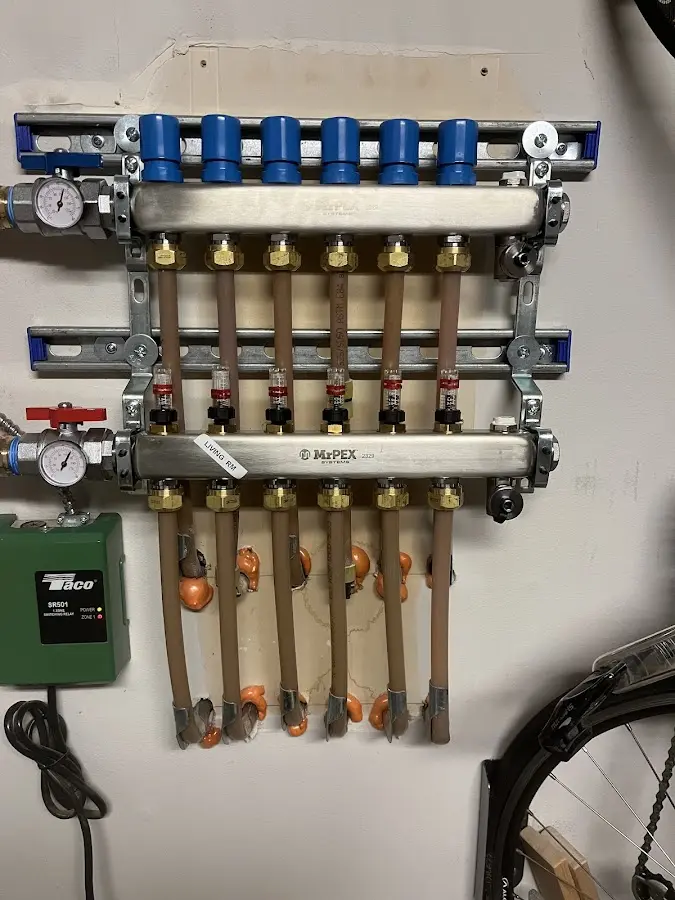 Plumber performing Water Heater Repair at a residential property in Edgerton